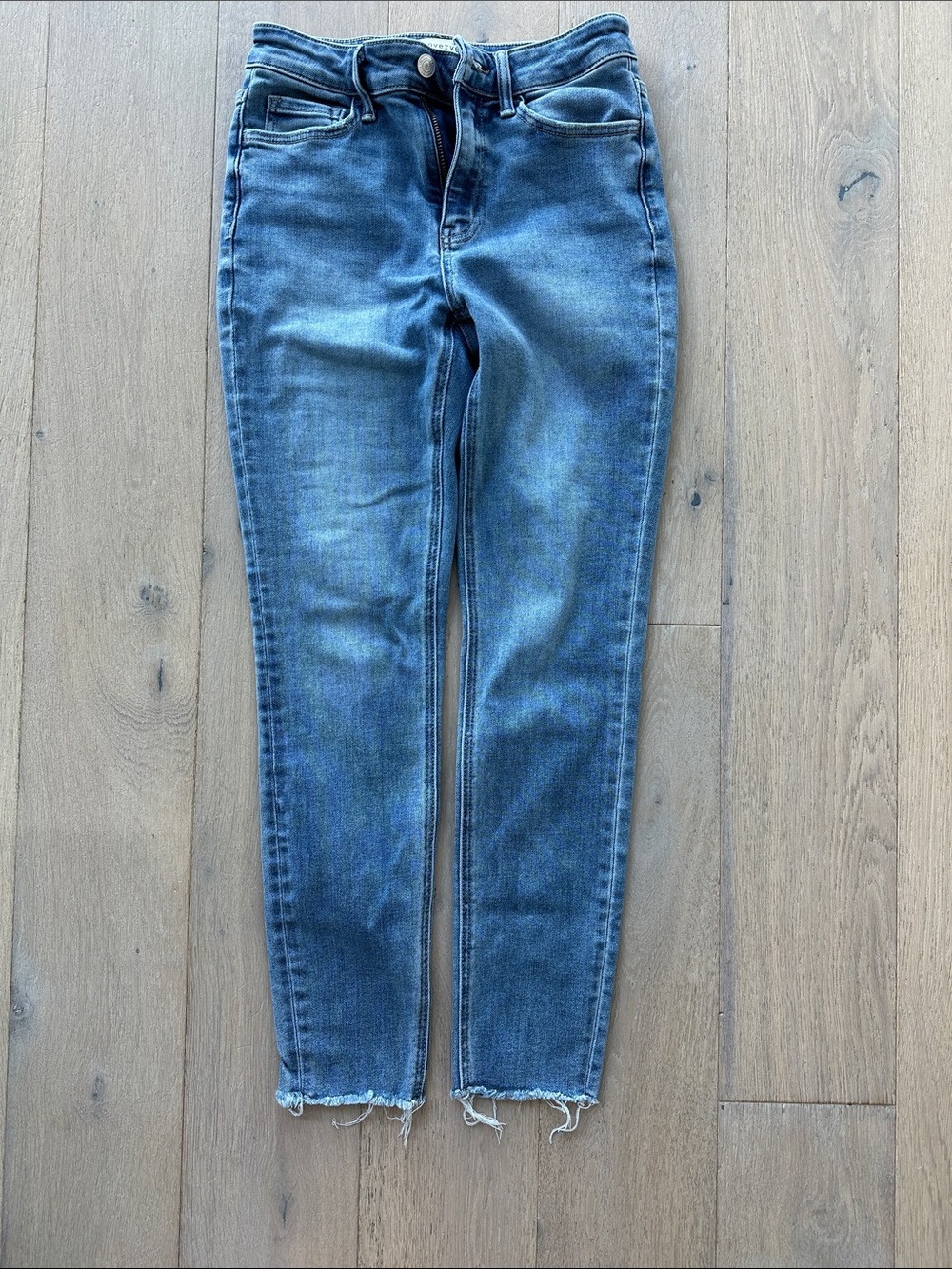 Skinny Mid-Rise Jeans in Washed Blue with Raw Hem